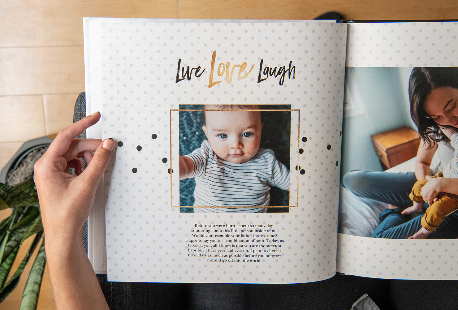 person holding a custom baby photo book with hardcover